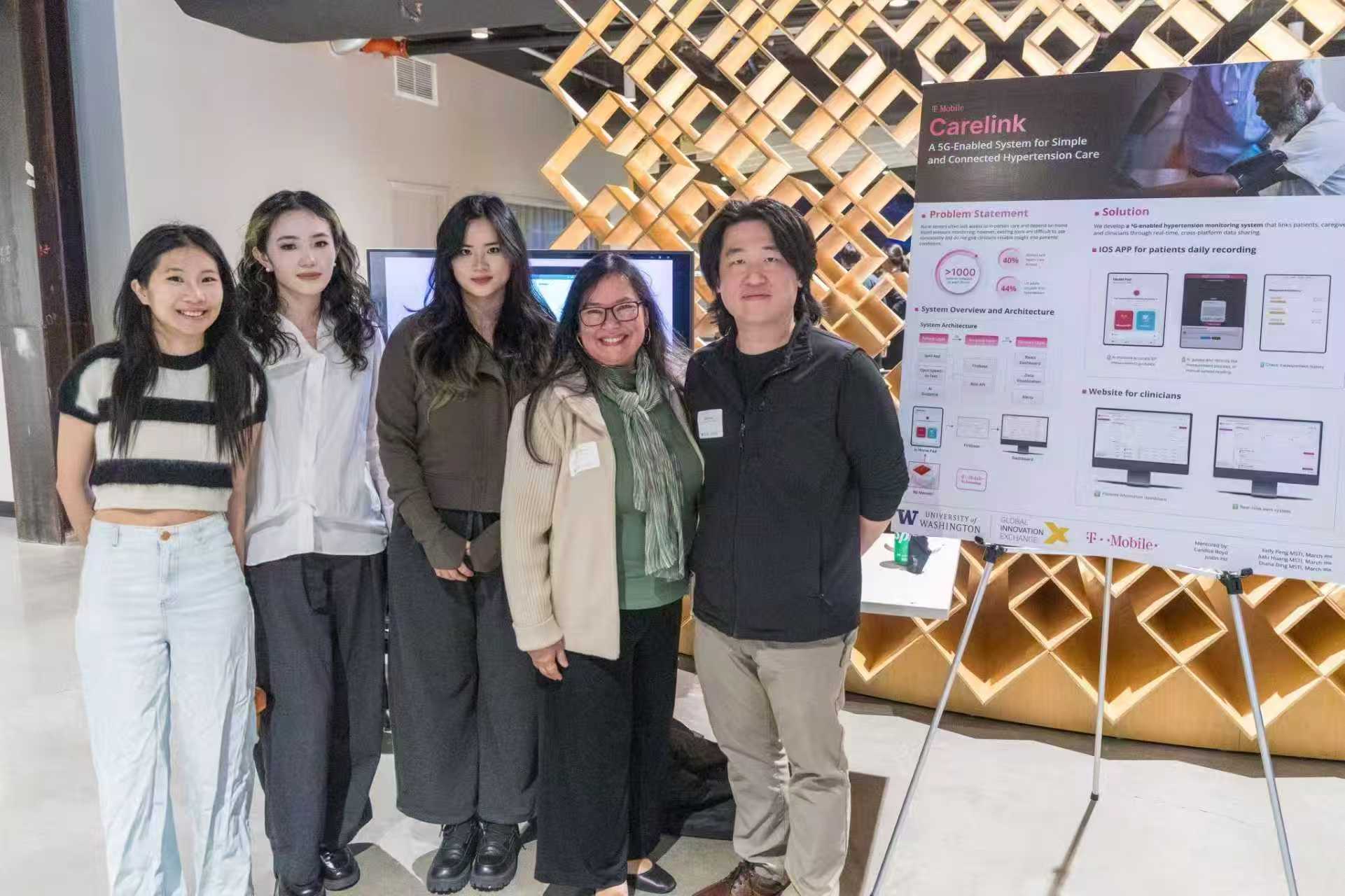 Kelly with the T-Mobile CareLink capstone team and presentation board